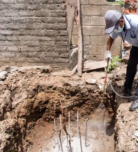 Post-construction injection along foundations
